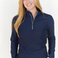 Woman wearing navy long-sleeve 1/4-zip top with wrist & finger holes 