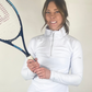 Woman in white Skea 1/4-zip long-sleeve top holding tennis racquet