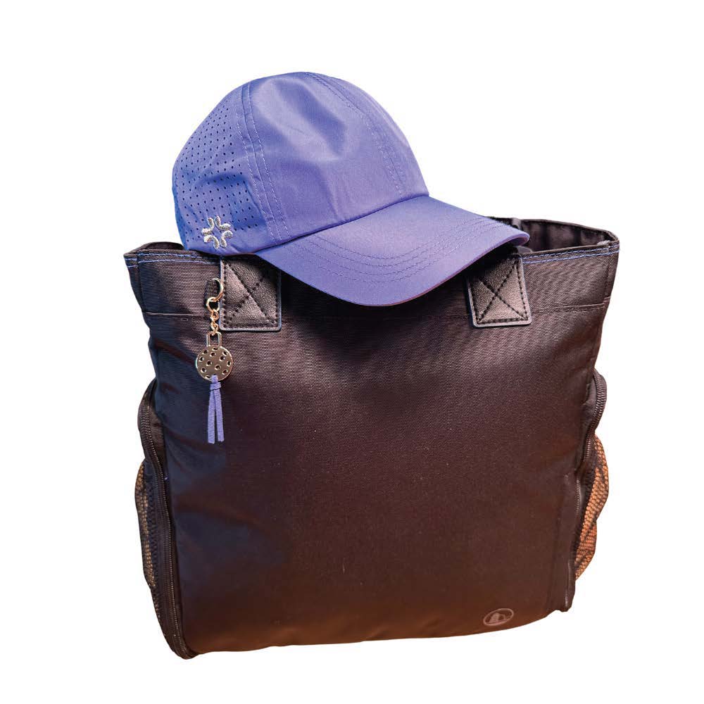 Black Gasparilla tote with Blue Vimhue baseball cap sitting on top, matching tassel on front of bag