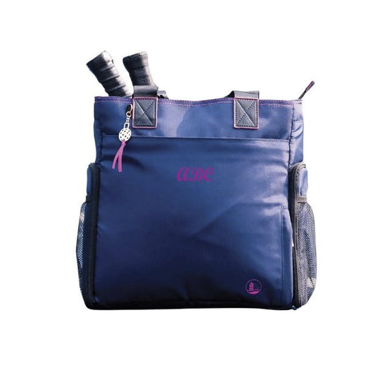 A stylish navy tote bag personalized with embroidered monogram, with two pickleball paddles, ideal for players seeking practicality and performance.