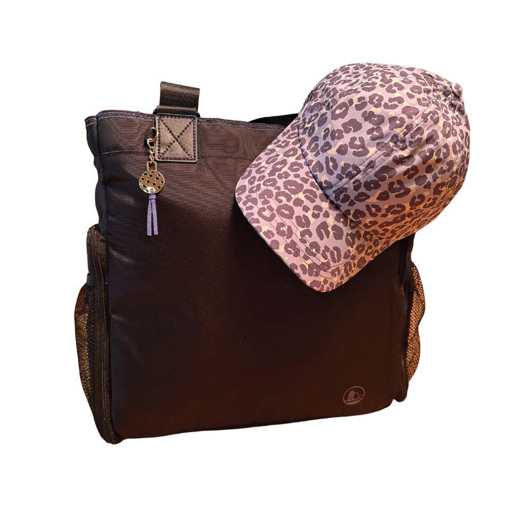 Women's Vimhue baseball cap in blue leopard sitting atop  Black Gasparilla tote by Lighthouse Sports