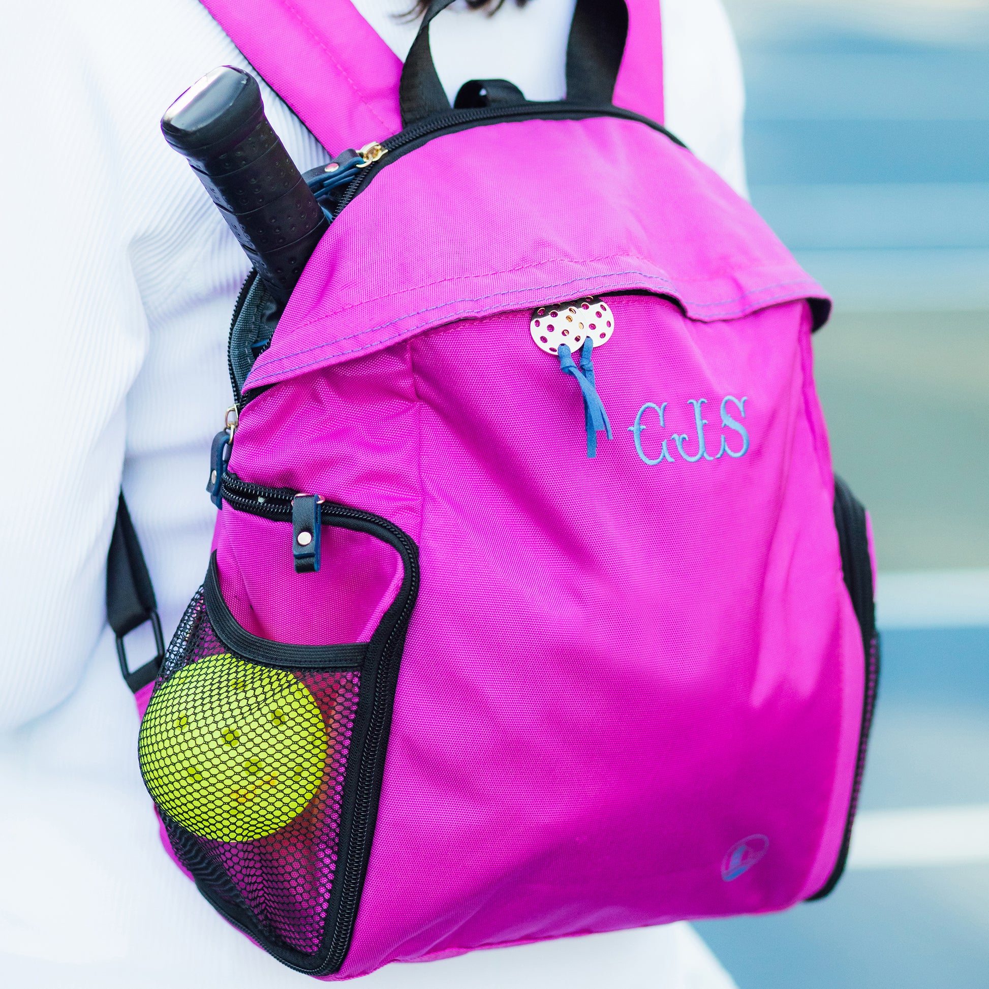 Backview of women wearing designer pickleball backpack, personalized with 3 monogrammed initials.