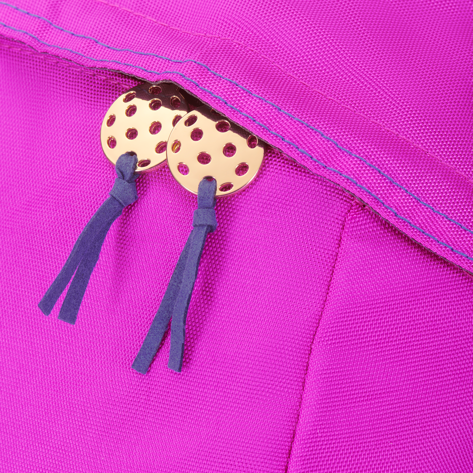 Detail on women’s designer pickleball backpack - cast metal pickleball charm, goldtone with Blue suede tassel